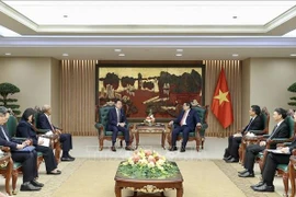越南政府总理范明政会见世界知识产权组织总干事邓鸿森。图自越通社