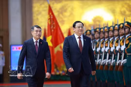 黎明兴总理举行隆重仪式 欢迎老挝总理对越进行正式访问