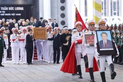 原越南国家主席陈德良追悼会隆重举行。图自越通社