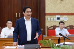越南政府总理范明政主持中央政治局第二工作组与西宁和宣光两省省委常务委员会的工作会议。图自越通社