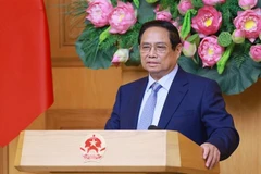 范明政总理发言。图自越通社