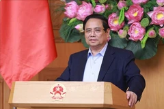 越南政府总理范明政发表讲话。图自越通社