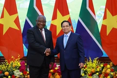 越南政府总理范明政会见南非总统马塔梅拉·西里尔·拉马福萨。图自越通社