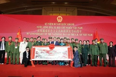 与会代表合影。图自越通社