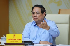 政府总理范明政在会议上发言。图自越通社
