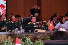 国防部长潘文江大将出席会议。图自越通社