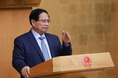 范明政总理发言。图自越通社