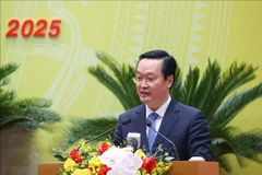 阮德忠同志发言。图自越通社