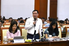 越南财政部财政预算司代表发言。图自越通社