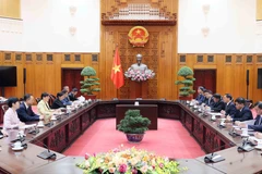 会见现场。图自越通社