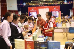老挝第六届国际图书节现场。图自越通社