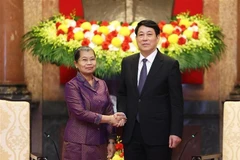 越南国家主席梁强会见柬埔寨人民党副主席梅森安。图自越通社