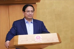 政府总理范明政主持召开政府9月份例行会议。图自越通社