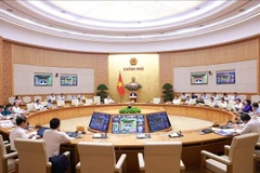政府总理范明政主持召开政府9月份例行会议。图自越通社