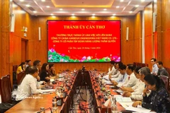 工作会谈现场。图自越通社