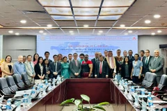 与会代表合影。图自越通社