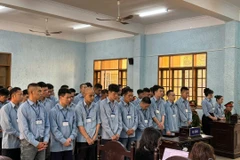 37名被告受审。图自越通社