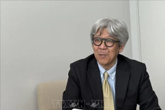 曾任共同社驻越南首席记者的三宅和久。图自越通社