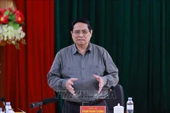 越南政府总理范明政发表总结发言。图自越通社