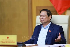 政府总理范明政在会议上发言。图自越通社