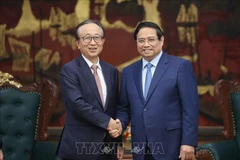 越南政府总理范明政会见日本三菱日联金融集团社长龟泽宏规。图自越通社