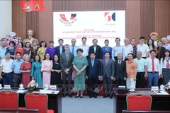 与会代表合影。图自越通社
