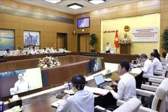工作会议场景。图自越通社