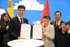 邮电学院与UNC合作备忘录签署仪式。图自越通社