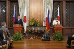 日本首相石破茂与菲律宾总统费迪南德·马科斯共同见记者。图自越通社