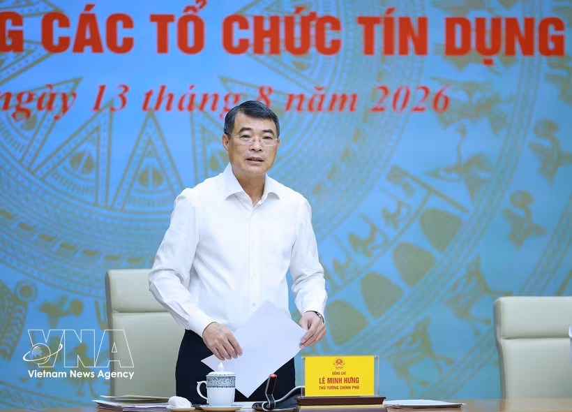 越南政府总理黎明兴在政府驻地主持同越南国家银行及信贷机构体系的工作会议。图自越通社