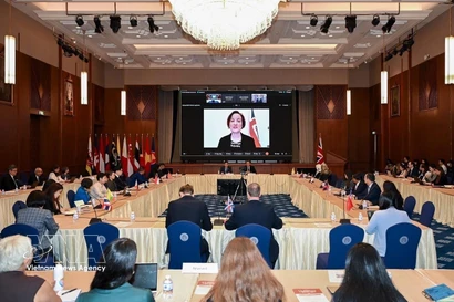 对话现场。图自越通社