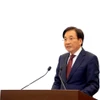 越南政府发言人陈文山部长在会上发表讲话。图自越通社