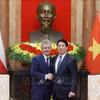 越南国家主席梁强会见捷克参议院议长米洛斯·维斯特奇尔。图自越通社
