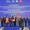 越南电力集团（EVN）与法国合作伙伴之间的北爱抽水蓄能电站两项贷款协议交换仪式。图自越通社