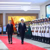 越南政府总理黎明兴与老挝总理宋赛·西潘敦检阅越南人民军仪仗队。图自越通社