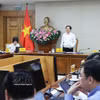 政府副总理胡国勇主持会议。图自越通社
