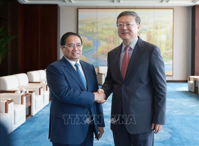 范明政会见上海市委书记陈吉宁。图自越通社 pham-minh-chinh-gap-bi-thu-thanh-uy-thuong-hai-tran-cat-ninh-stand.jpg