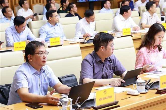 会议现场。图自越通社 chu-tri-phien-hop-lien-bcd-ve-xoa-nha-tam-va-du-an-trong-diem-8106070.jpg