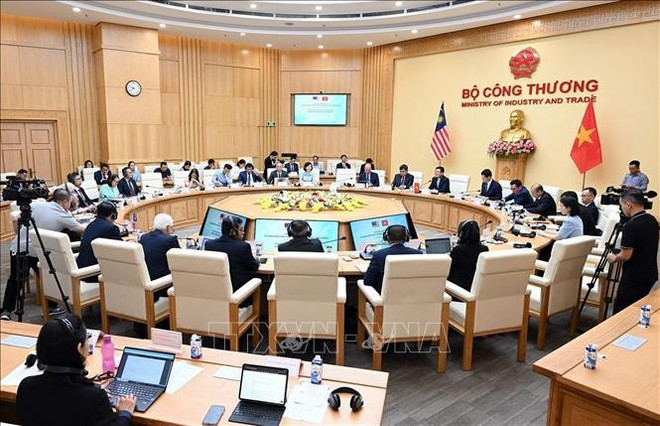 2024年7月举行的越马贸易混合委员会第四次会议。图自越通社 vna-potal-ky-hop-thu-4-uy-ban-hon-hop-thuong-mai-viet-nam-malaysia-stand.jpg