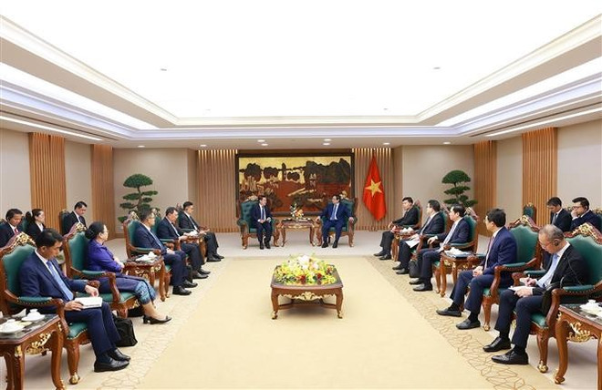 会见现场。图自越通社 vna-potal-thu-tuong-tiep-pho-thu-tuong-truong-ban-cai-cach-doanh-nghiep-lao-8208094.jpg