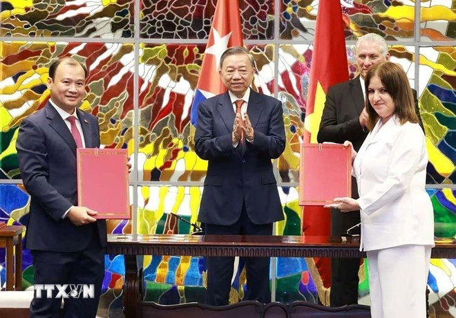 越古合作协议签署仪式现场。图自越通社 ky-van-kien-vn-cuba.jpg