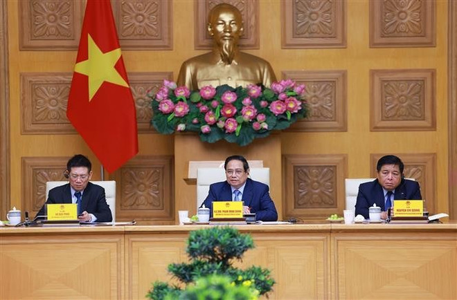 会议场景。图自越通社 tuong-pham-minh-chinh-gap-mat-dai-dien-doanh-nghiep-hoa-ky-8028619.jpg