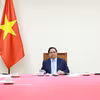 越南政府总理范明政与卡塔尔首相兼外交大臣通电话 。图片来源：越通社