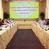 双方工作座谈场景。图自越通社