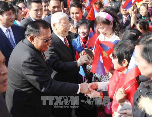阮富仲举行仪式欢迎老挝人革党中央总书记、国家主席访越 ảnh 2