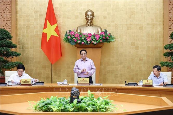 越南政府总理范明政主持政府立法工作会议 ảnh 1