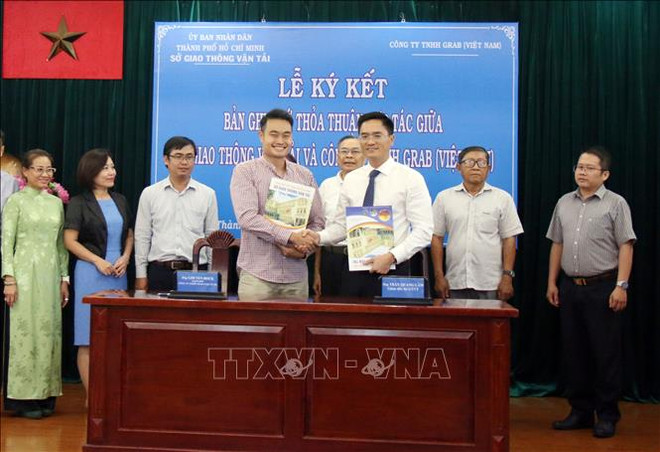 胡志明市与Grab(越南)公司共建智能交通系统 ảnh 1