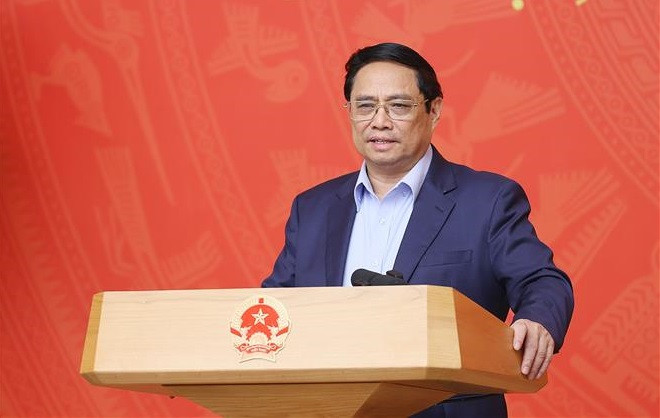 政府总理范明政：在一切为了国家和民族利益的精神上推进国际融入进程 ảnh 1