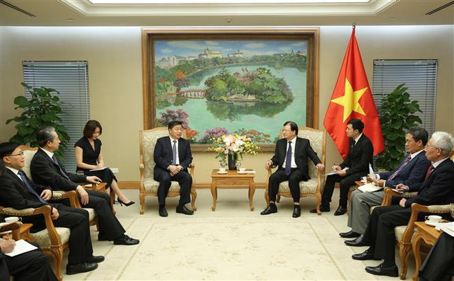 越南政府副总理郑廷勇会见中国广东省副省长欧阳卫民 ảnh 2