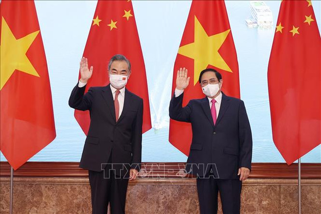 越南政府总理范明政会见中国国务委员、外交部长王毅 ảnh 1 越南政府总理范明政会见中国国务委员、外交部长王毅 ảnh 1